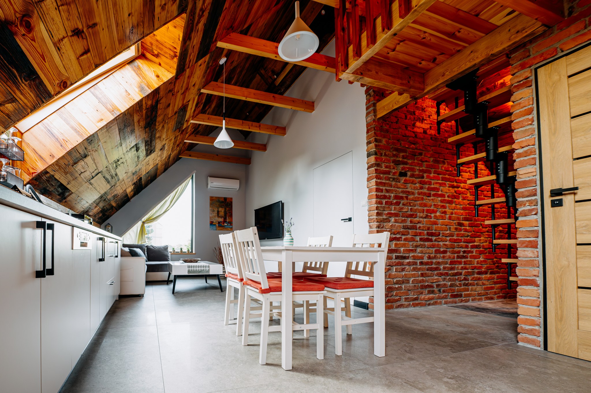 a dining room with a table and chairs